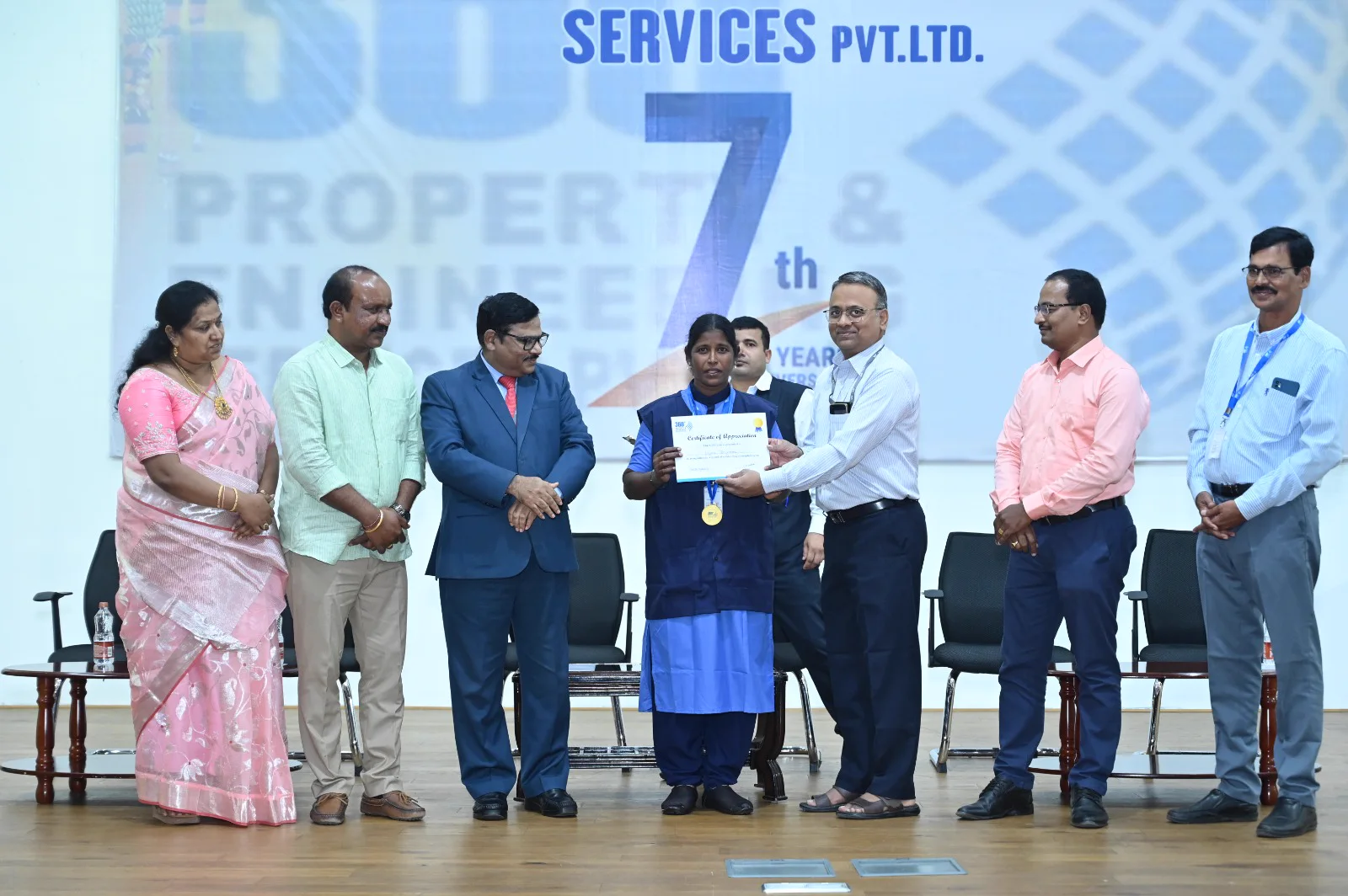Employee receiving a certificate of appreciation at the company recognition event